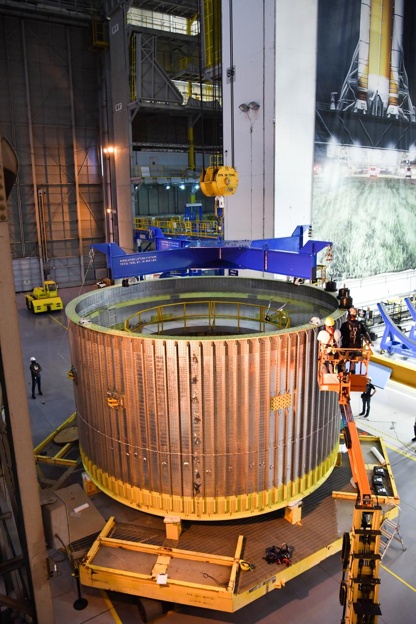 The Space Launch System (SLS) rocket’s liquid oxygen tank structural test article was manufactured and stacked in June 2019 at NASA’s Michoud Assembly Facility in New Orleans. To construct the test article, Boeing technicians at Michoud moved the liquid oxygen tank to the Vertical Assemby Building stacking and integration area. Here, they added simulators to mimic the two structures that connect to the tank, the intertank and the forward skirt.  This structural hardware for the SLS core stage for America’s new deep space rocket is structurally identical to the flight version of the tank. It will be shipped on the Pegasus barge to NASA’s Marshall Space Flight Center in Hunstville, Alabama, where it will undergo a series of tests that simulate the stresses and loads of liftoff and flight. These tests will help ensure designs are adequate for successful SLS missions to the Moon and beyond. The flight liquid oxygen tank along with the liquid hydrogen tank supplies more than 500,000 gallons of propellant to the core stages four RS-25 engines, which produce 2 million pounds of thrust to help send the SLS rocket to space.